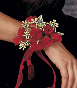 Red mini roses corsage with accents of of eucalyptus berries and ribbon
