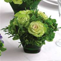 Wedding flower centerpiece. Green cabbage roses in glass vase