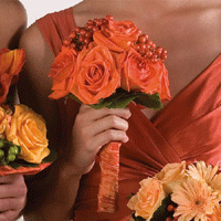 Brides maid bouquet featuring orange roses